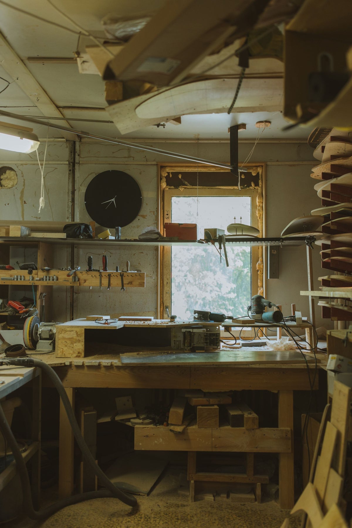 A home workshop with tools on the walls